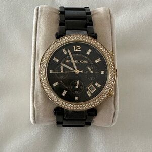 Elegant Black and Gold Watch with Crystal Bezel